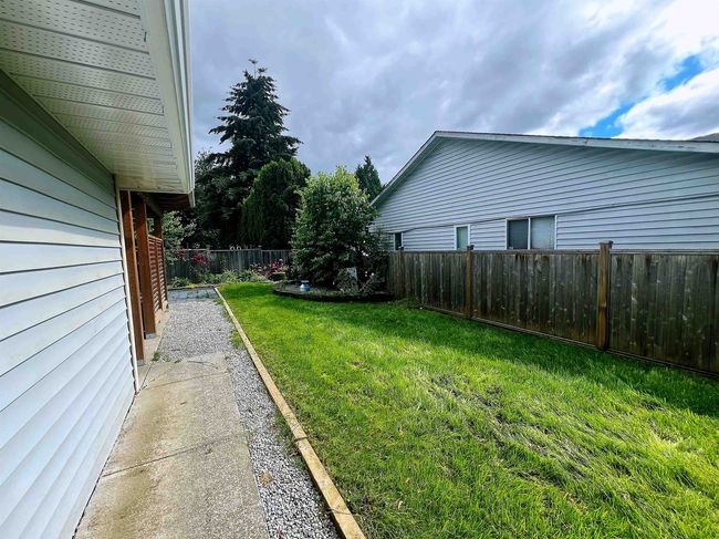 View of fenced backyard | Image 14