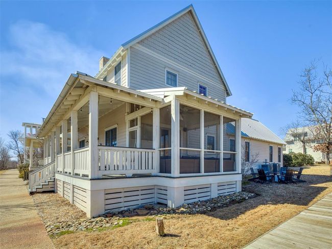 View of side of property featuring a sunroom | Image 37