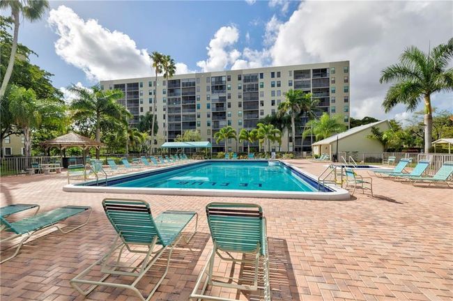View Of Your Building From The Pool, Lots of Loungers | Image 46
