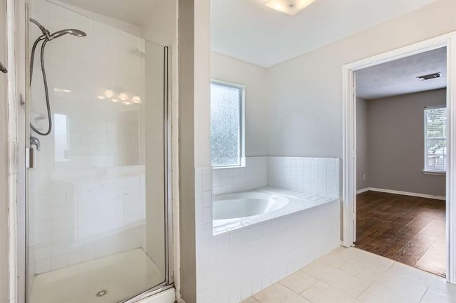 Primary bathroom with seperate shower and tub. | Image 28