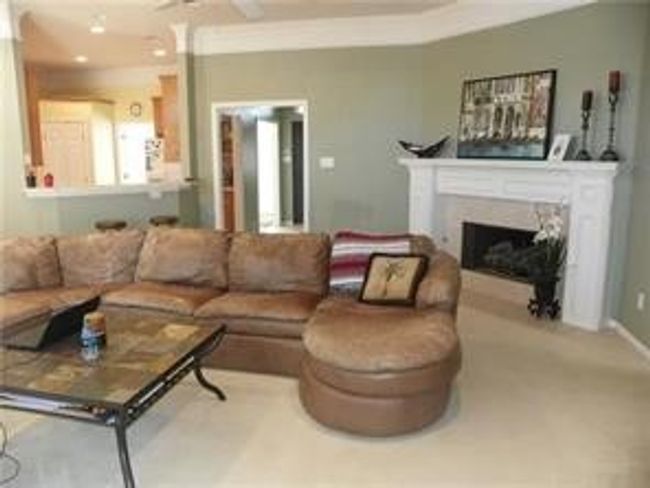 Large open Family room with a wood burning fireplace | Image 7