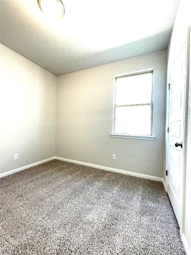 Spare room featuring carpet flooring | Image 19