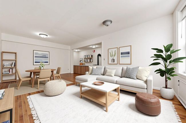 Living area with wood finished floors | Image 6