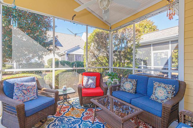 Sunroom with ceiling fan and lofted ceiling | Image 30
