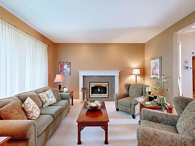 Living area featuring light colored carpet and a glass covered fireplace | Image 9