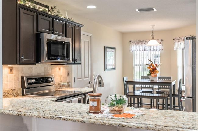 Espresso cabinets and updated Kitchenaid stainless steel appliances | Image 5