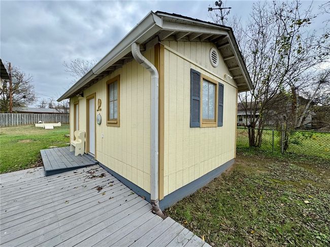 View of side of property featuring a deck and a fenced backyard | Image 34