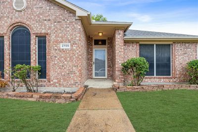 Entrance to property featuring a lawn | Image 2