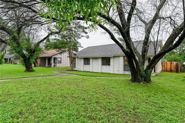 View of front facade with brick siding and roof with shingles | Image 19