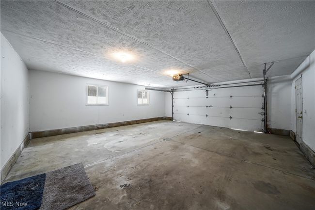 Garage with a garage door opener | Image 31