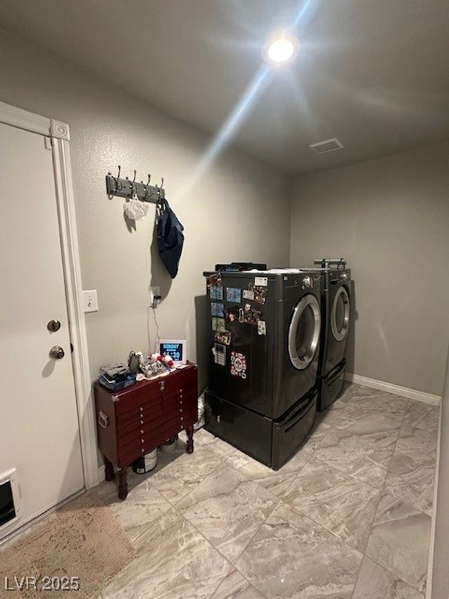 Laundry room featuring washer and dryer | Image 12
