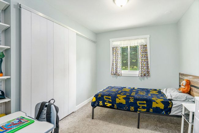 BEDROOM #2 - SLIDING CLOSET DOOR - BUILT IN SHELVES | Image 10