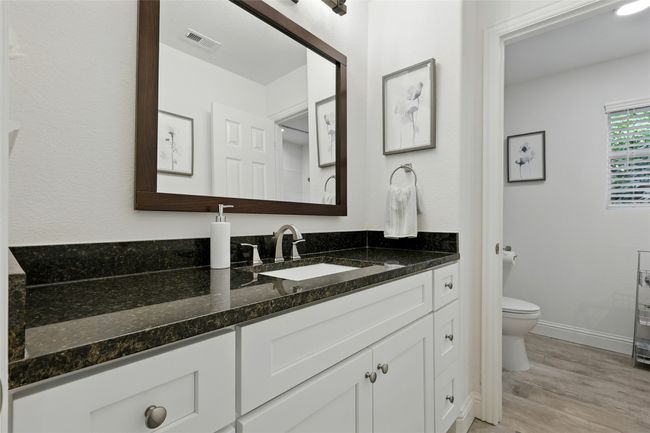 Second level bathroom featuring vanity and wood-like finished floors | Image 26