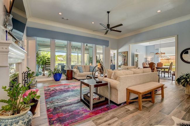 An expansive open-concept living room bathed in natural light | Image 5