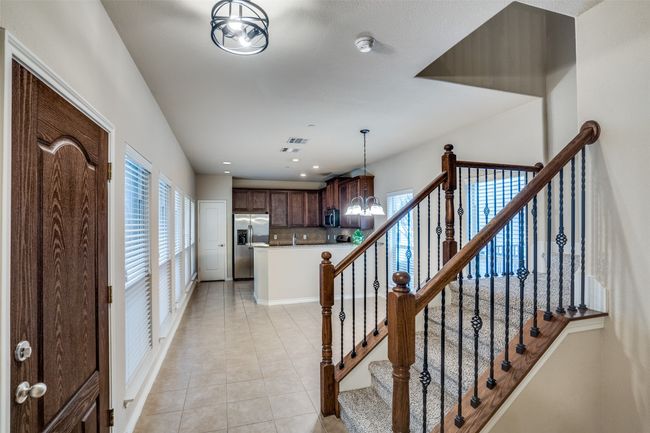 Stairs featuring a modern lighting, tile flooring, ceiling fan, and recessed lighting | Image 11