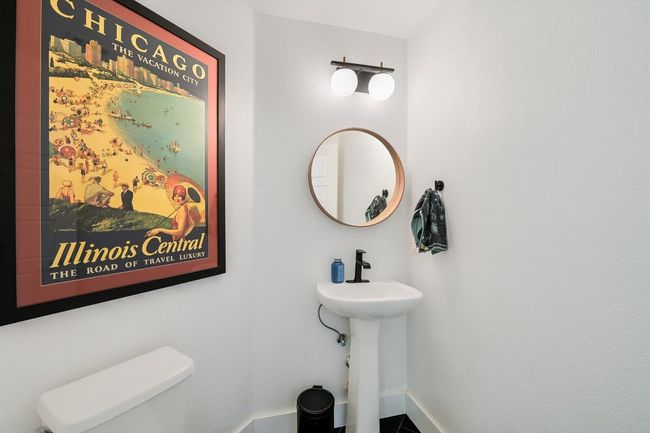 Half bathroom featuring toilet and baseboards | Image 12