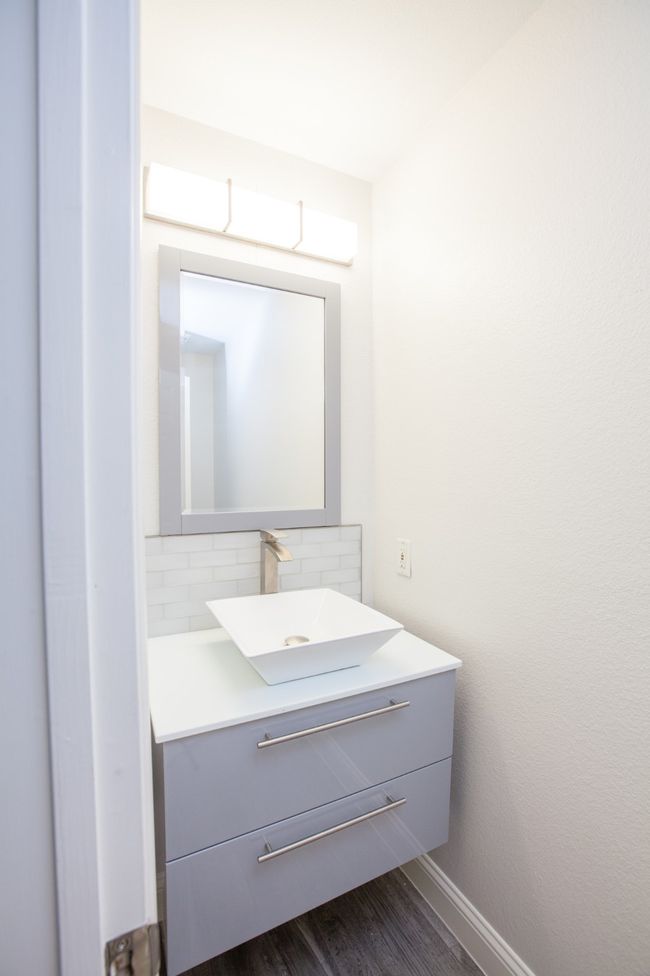 Bathroom with vanity, tasteful backsplash, and wood finished floors | Image 22