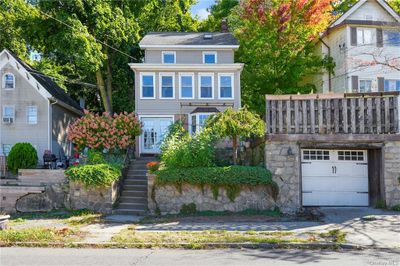 View of front of property with a garage | Image 1