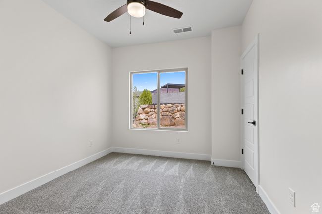 Spare room with baseboards, visible vents, ceiling fan, and carpet | Image 35