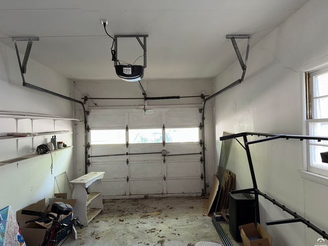 Attached garage with newer automatic opener | Image 54