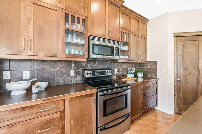 419 Cimarron Blvd, House other with 3 bedrooms, 3 bathrooms and 4 parking in Okotoks AB | Image 6