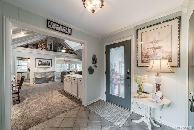 Inviting cased entryway into the living room | Image 9