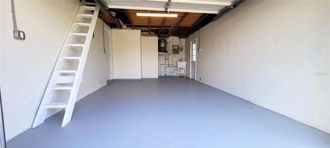 Garage with ladder to attic- washer and dryer hook-up. New water heater and new utility tub | Image 20