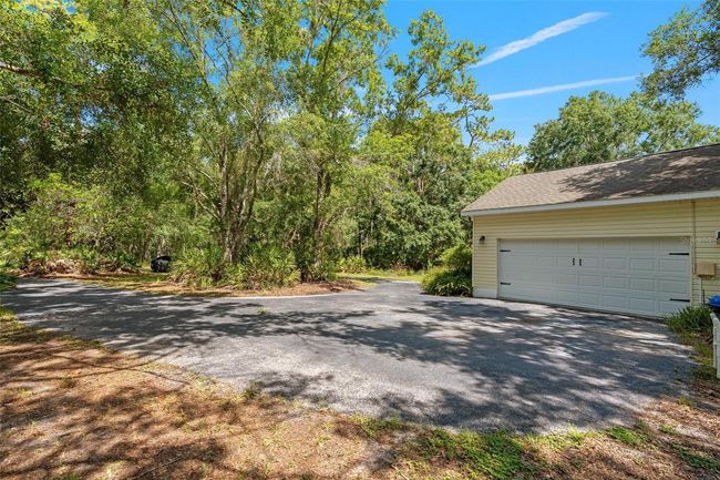 11933 Pasco Trails Blvd, House other with 4 bedrooms, 3 bathrooms and null parking in SPRING HILL FL | Image 33