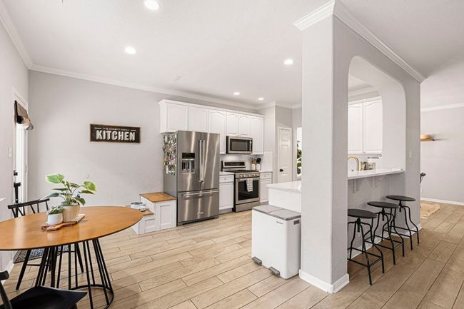 Bright kitchen with adjoining casual dining space | Image 10