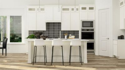 Kitchen featuring tasteful backsplash, white cabinets, pendant lighting, and black microwave | Image 3