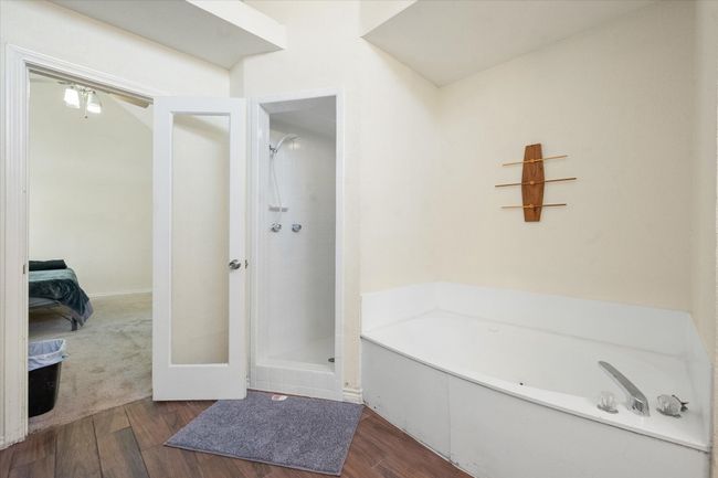 Primary bathroom has a separate tub and shower. | Image 29