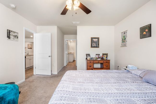 Bedroom featuring baseboards, carpet flooring, and a ceiling fan | Image 26