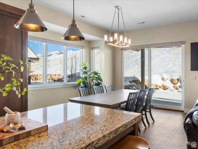 Dining room with a chandelier | Image 16