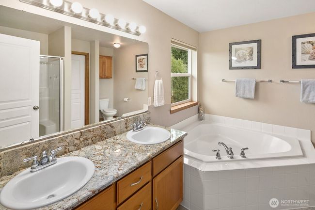 Primary bathroom with soaking tub. | Image 13