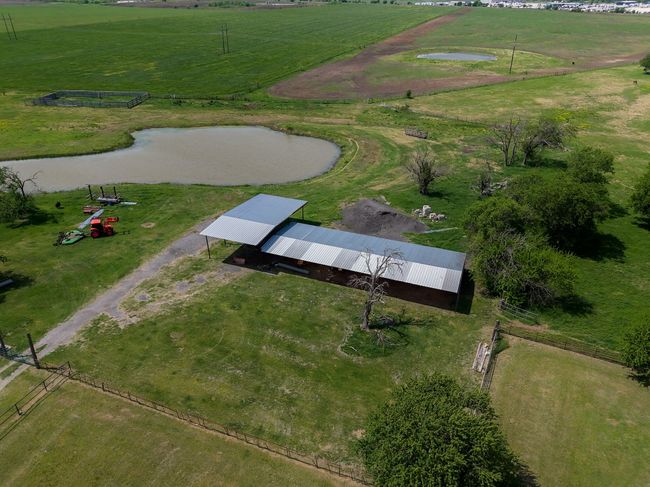 View of property location featuring rural landscape, agricultural land, and a large body of water | Image 4