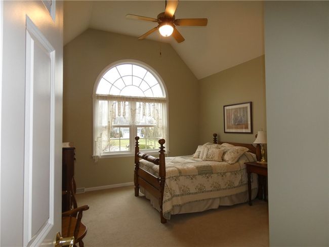 Bedroom 3 features a vaulted ceiling and Palladian style window | Image 36