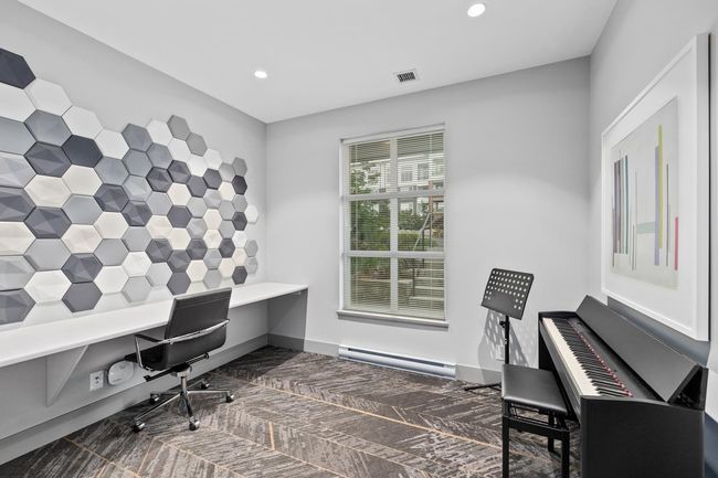 Office space featuring baseboards, visible vents, recessed lighting, and a baseboard radiator | Image 40