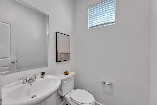 Bathroom with toilet and a sink | Image 25