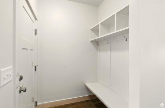 Mudroom featuring dark wood-style flooring and baseboards | Image 24