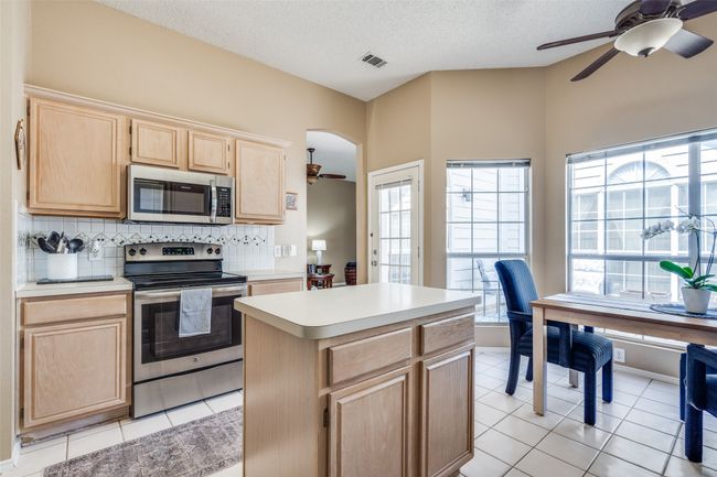 Traffic flows easily from the living room to the spacious kitchen. | Image 13