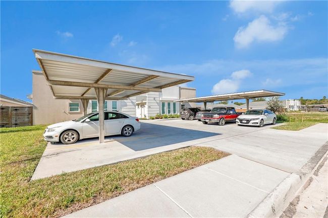 View of vehicle parking with a carport | Image 21