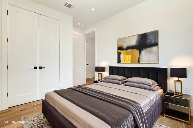 Bedroom featuring light wood-type flooring, a closet, and recessed lighting | Image 16