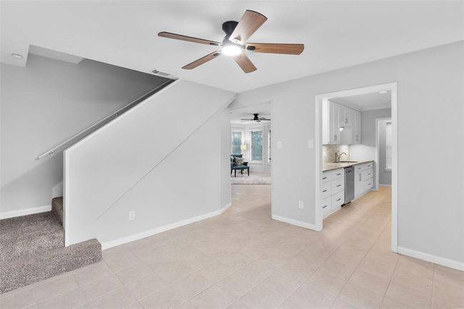 Entertain guests in this dining room with access to the kitchen & living room. | Image 13