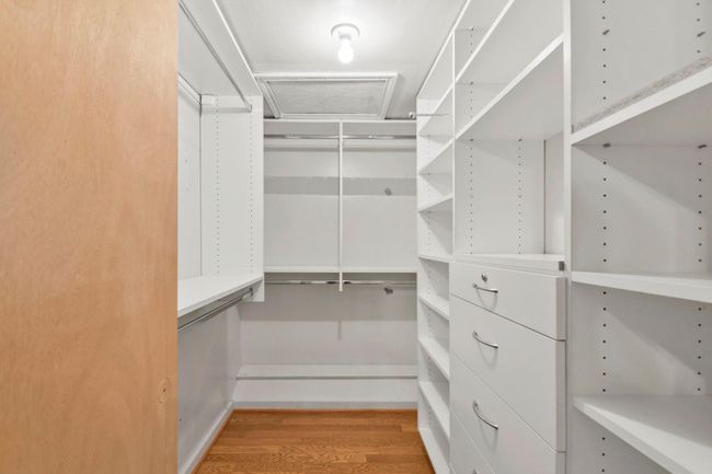 Expansive walk-in closet with ample storage solutions. | Image 22