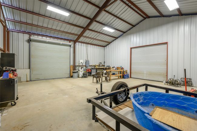 Interior view of shop. Note the overhead doors. | Image 31