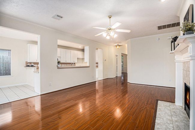 Open concept living room, kitchen, and breakfast room. | Image 5