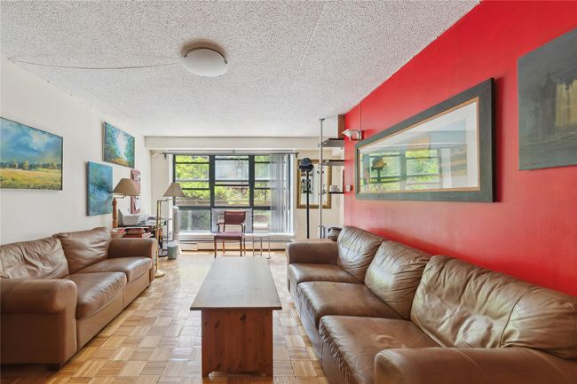 Living area featuring a textured ceiling | Image 10
