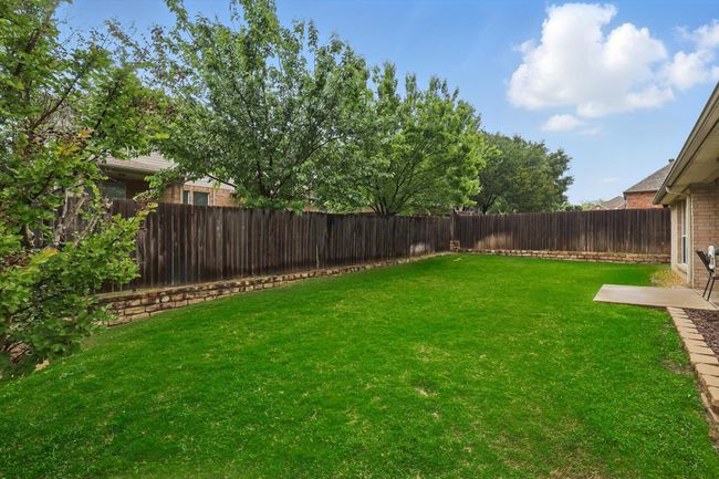 View of yard featuring a fenced backyard | Image 36