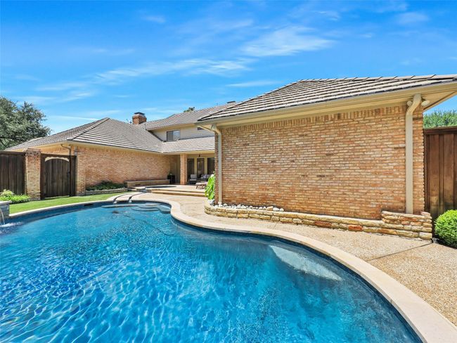 View of swimming pool featuring a patio | Image 36