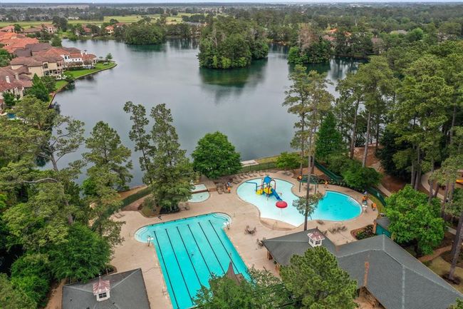 The Aquatic Complex includes an ATHLETIC POOL #1: 8-lane 25-yard competition pool. Home of the Gleannloch Gators swim team, Masters Swim Program & PACK Training Program as well as swimming lessons are offered. A RECREATION CENTER POOL #2: includes an adult pool and kiddie activity pool with water features. THE BLUFF POOL #3– a lazy pool. | Image 42